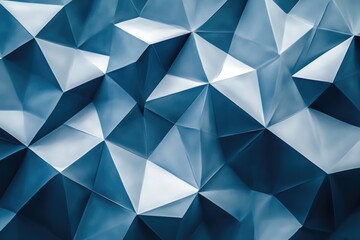 Obraz premium A striking geometric image filled with triangular shapes in shades of blue, illustrating depth and modernity, perfect for backgrounds in digital designs.