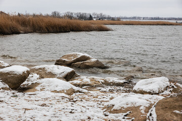 snow-covered lakeshore on a winter's day