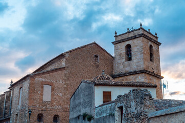 Ancient church in Montesa town, on a cloudy morning day.