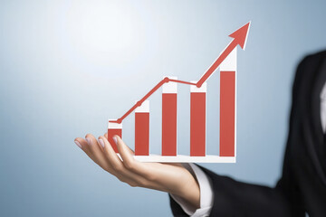 Businesswoman holding growth chart, symbolizing financial success and progress