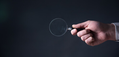 magnifying glass in hand