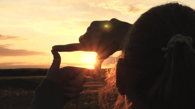 sign photo video frame, girl shows hands fingers sunset frame, family dream happiness journey, girl imitating photo sunlight, hipster young girl photo video frame sign, woman making frame fingers