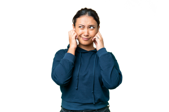 Young Uruguayan woman over isolated chroma key background frustrated and covering ears