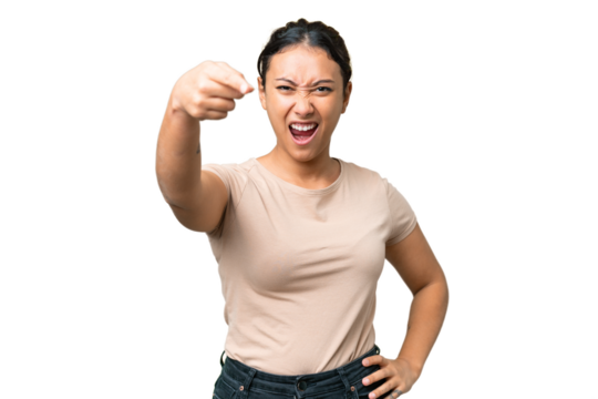 Young Uruguayan woman over isolated chroma key background frustrated and pointing to the front - Powered by Adobe