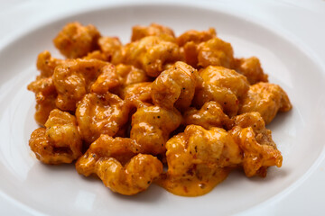 Up close photo of fried shrimp with sauce
