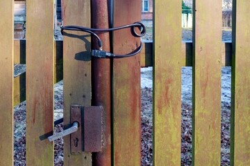 The gate is locked. The lock is with a steel cable.