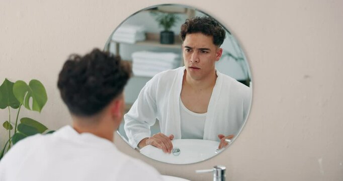 Man, mirror and face for motivation in bathroom of self care pep talk, morning routine and skincare beauty. Male person, reflection and grooming affirmations, wellness benefits and confidence at home