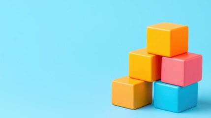 Fototapeta premium Colorful Building Blocks Stacked on a Bright Blue Background
