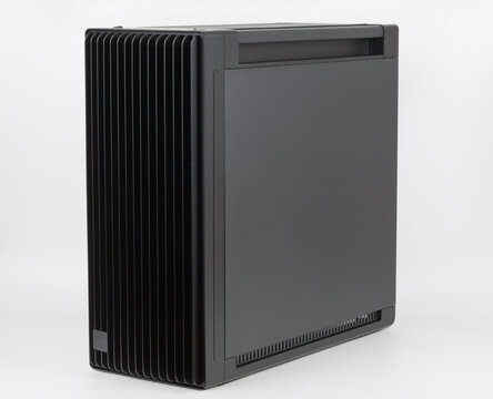 Side view of empty  big tower, PC case, chassis, 15.5 mm front panel grille with 45% porosity for maximum air intake. Studio shoot on white background.