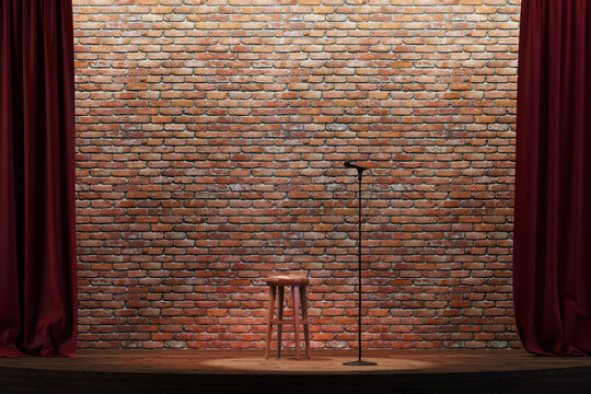 Empty stand-up stage with a microphone and brick wall on background