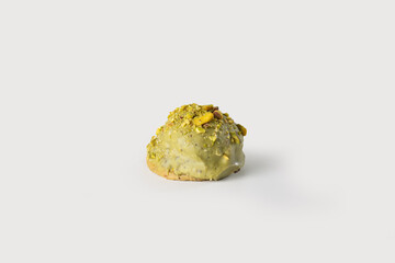  golden, flaky Neapolitan rama filled with creamy pistachio, offering a delightful and rich taste, perfect for a sweet treat, set against a simple white background.