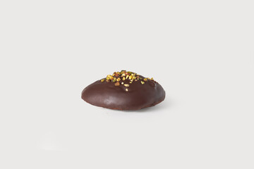 A golden, flaky Neapolitan rama filled with rich chocolate and crunchy hazelnuts, offering a decadent and indulgent treat, set against a clean white background.