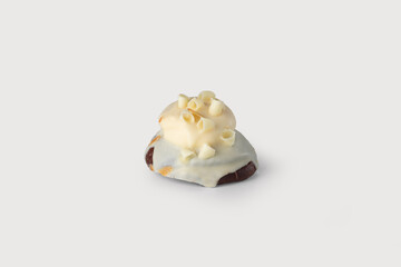 A golden, flaky Neapolitan rama filled with smooth white chocolate, offering a rich, sweet indulgence, perfect for a decadent treat, set against a simple white background.