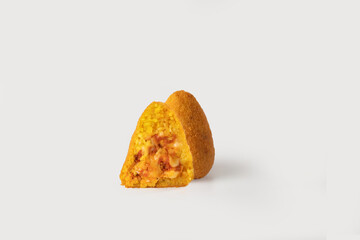
A golden, crispy arancino cut in half, revealing its rich, savory filling of rice, cheese, and meat, showcasing the perfect balance of flavors, on a clean white background.