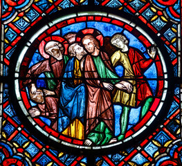 Stained glass (19th century) of Jesus receiving kiss of Judas. .