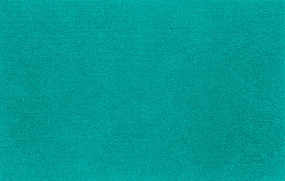 The texture of the canvas fabric is aqua green color. Horizontal abstract blank background for design ideas. Rustic linen.