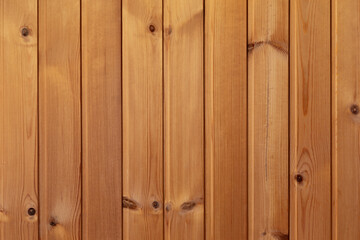 Wooden background, beautiful clean even wood structure. Texture of wooden planks with vertical stripes, waves, age rings, knots