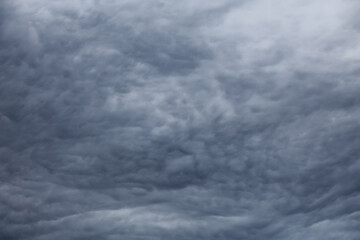 Tight mystical sky with contrasting dark grey clouds