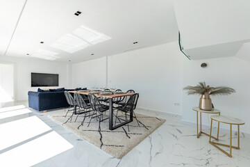 an image of a luxurious open living and dining room area in a mediterranean villa real estate property for sale 