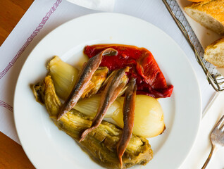 Traditional Spanish dish Escalivada con anchoas - roasted red pepper, eggplant and onion with anchovies