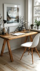 Obraz premium A functional yet stylish workspace in a Scandinavian home, featuring a white frame above a wooden desk.
