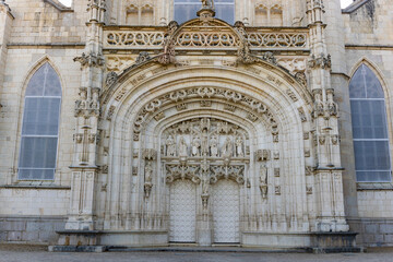 Masterfully decorated facade of Royal Monastery of Brou. Religious complex in Flamboyant Gothic style at Bourg-en-Bresse, France.