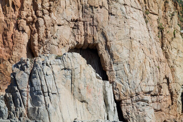 Textured Rocky Cliff with Natural Archway