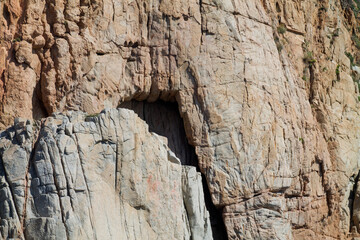 Close-Up of Rocky Cliff with Arch Opening