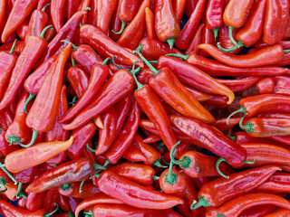 Heap Of Ripe Big Red Peppers At Street Market. Peppers background