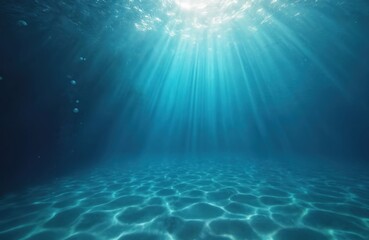Sun light pierces clear blue deep water, illuminates seabed. Marine background of underwater sea bottom with sand, sunbeams, bubbles and light rays. Depth of aqualung, diving, snorkeling.