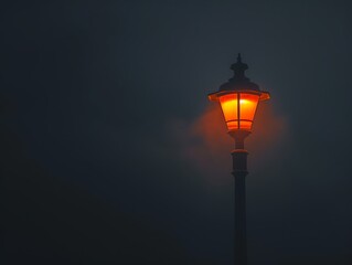 Street lamp on a pole, isolated against black foggy night, orange light, minimalist style, low angle, wide-angle lens, shallow depth of field, cinematic quality.