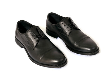 black leather shoes on a white background