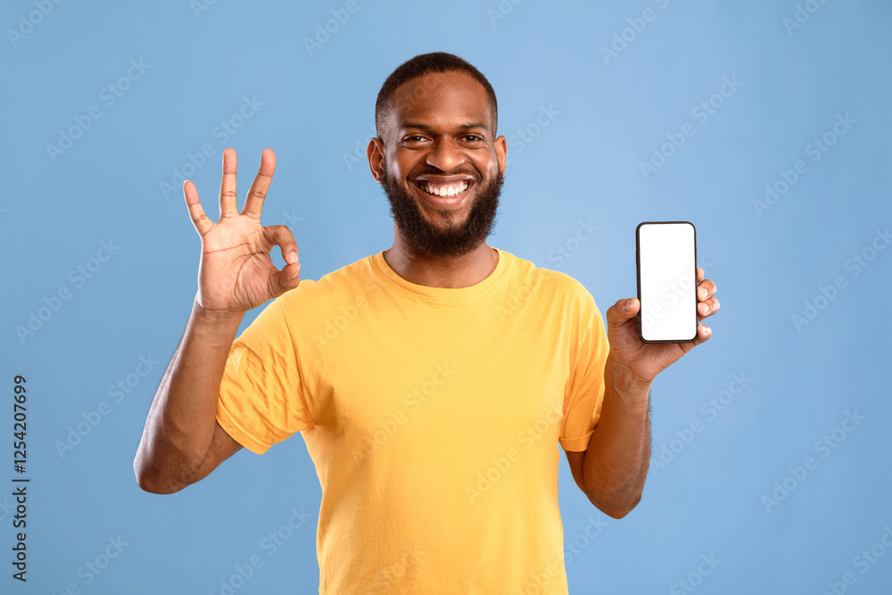 Poster i recommend this new mobile app. cool young african american guy showing empty smartphone and gestur