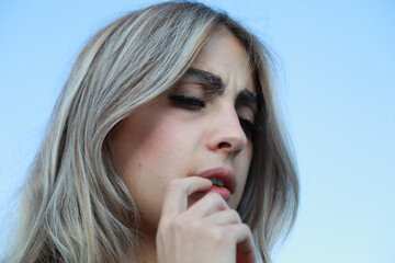 Worried Woman Biting Her Finger