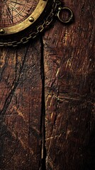 Obraz premium Antique compass on weathered wooden surface