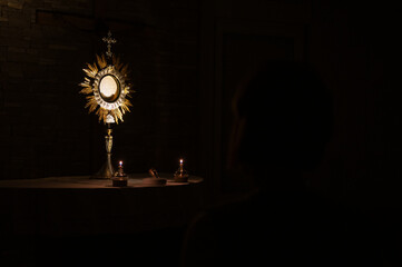 Adoration of the Blessed Sacrament at night in a community chapel in Medjugorje.