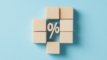 Obraz premium Wooden blocks forming percentage sign, blue background, interest rate concept