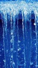 Blue water cascading from a fountain