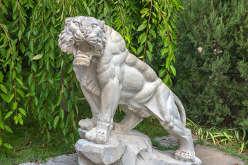 an impressive stone sculpture of a tiger installed in the Taigan Lion Park. 
