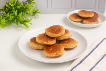 Kue kamir. Kamir cake on a white plate. Also called khamir. Perfect for recipe, article, catalogue, or any commercial purposes.