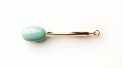 Elegant mint green beauty tool with a sleek gold handle on a clean white background