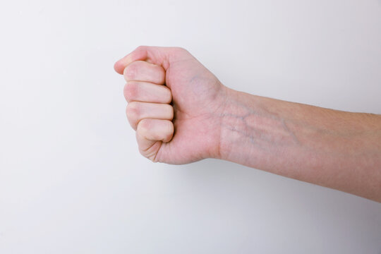 Woman with visible hand veins on white background, closeup