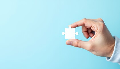 Holding Puzzle Piece - Solution and Connection Concept with Light Blue Background