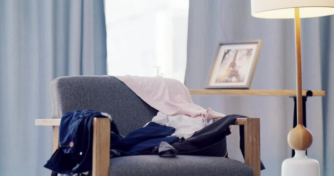 Timelapse, laundry and clothes for washing in home with chair, spring cleaning or housekeeping in bedroom. Room, chaos and mess with disorganized clothing, fabric and empty apartment, lounge or house