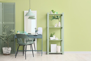 Interior of makeup room with shelf unit and cosmetic refrigerator on table