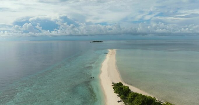 Aerial drone of tropical sandy beach and blue sea. Timba Timba islet. Tun Sakaran Marine Park. Borneo, Sabah, Malaysia.