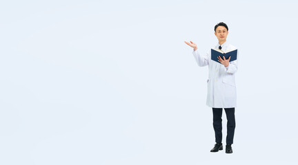 本を持って案内する白衣を着たミドル男性の全身写真　医師　科学者　研究者（切り抜き背景透過PNGも販売しております。作成者リンクから「PNG」で検索してください）