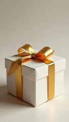 Obraz premium Elegant gold-wrapped gift box with delicate golden accents, golden, accents