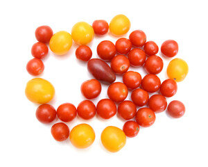 Mini black, red, and yellow tomatoes isolated on white