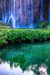 Lake in deep forest in the Plitvice Lakes national park in Croatia. Beautiful waterfalls of Plitvice. Exotic nature of waterfalls.